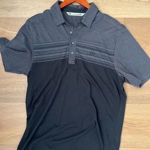 Travis Mathew’s polo size medium fits on the larger side